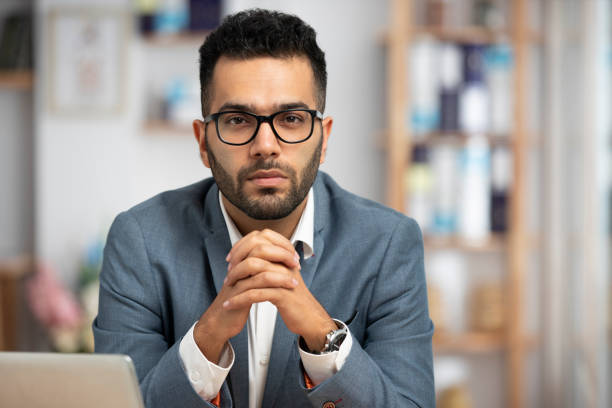 shot of a handsome young businessman looking tired